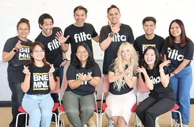 Diverse offshore team from Philippines and Colombia working together for advertising agency